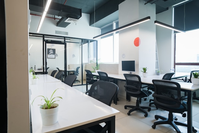 Empty office desks in a modern workspace, representing wasted retainer spend and idle capacity.